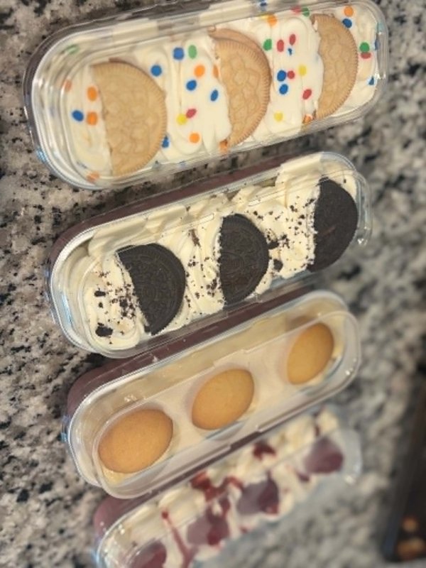 Assorted dessert cups including birthday cake Oreo, classic Oreo, banana pudding, and strawberry