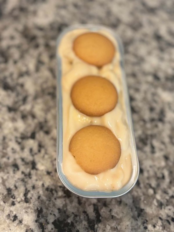 Banana pudding dessert cup with nilla wafers and creamy yellow custard