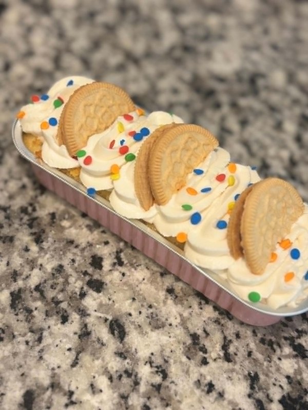 Birthday cake Oreo dessert cup with rainbow sprinkles and golden Oreo halves